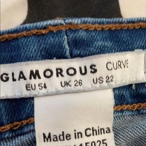 Women’s 22W jeans with distressed knees, 0 worn